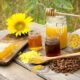 54612483 - various bee products placed on a wooden table